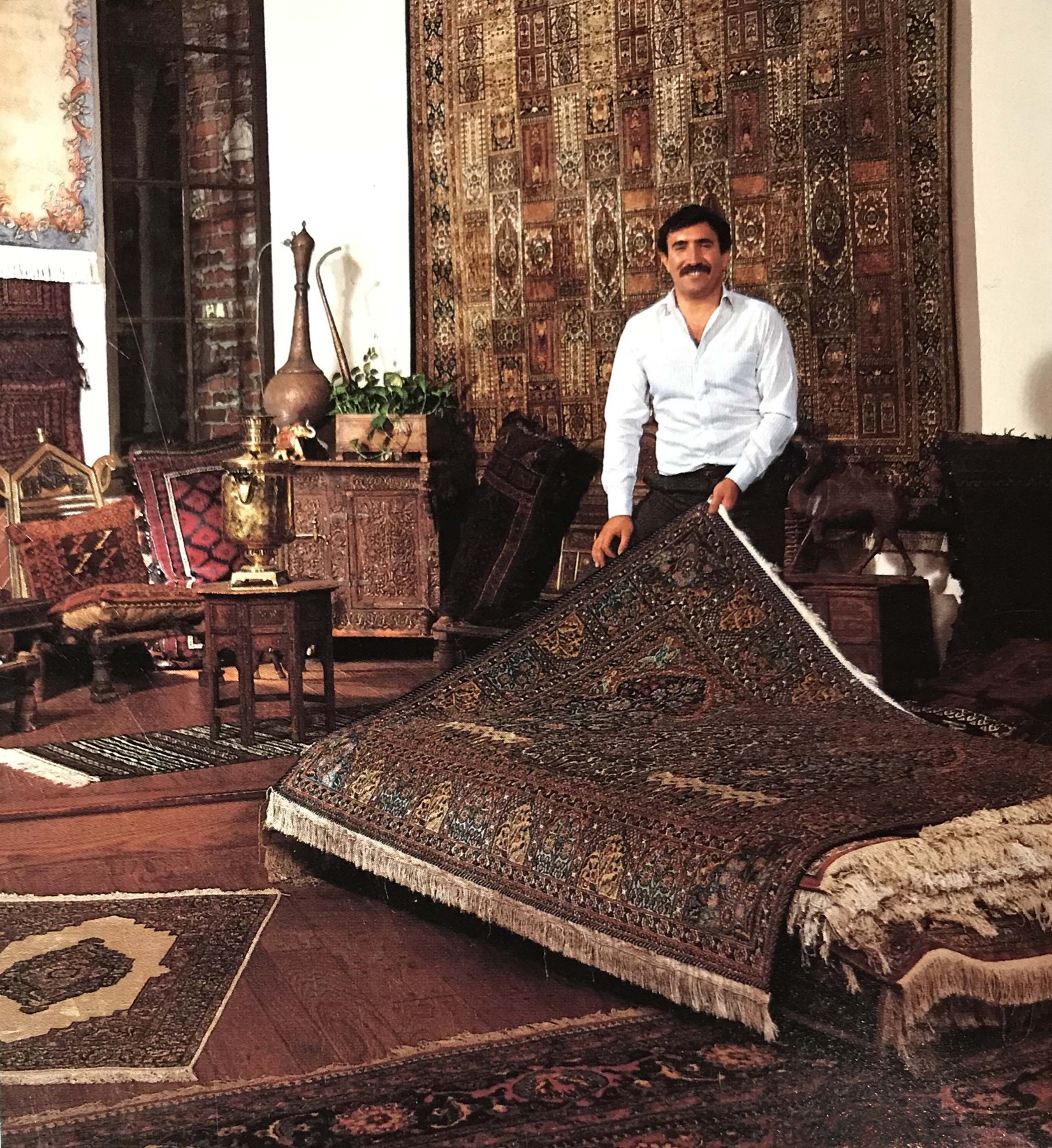 Sadiq Tawfiq rolling a carpet inside Khyber Pass Gallery